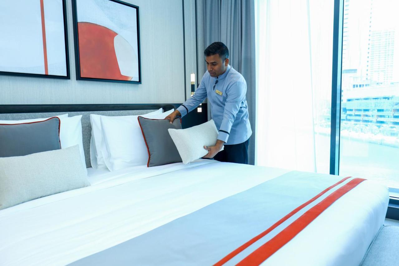 Charthouse Bahrain Hotel Manama Exterior photo A hotel housekeeper making a bed