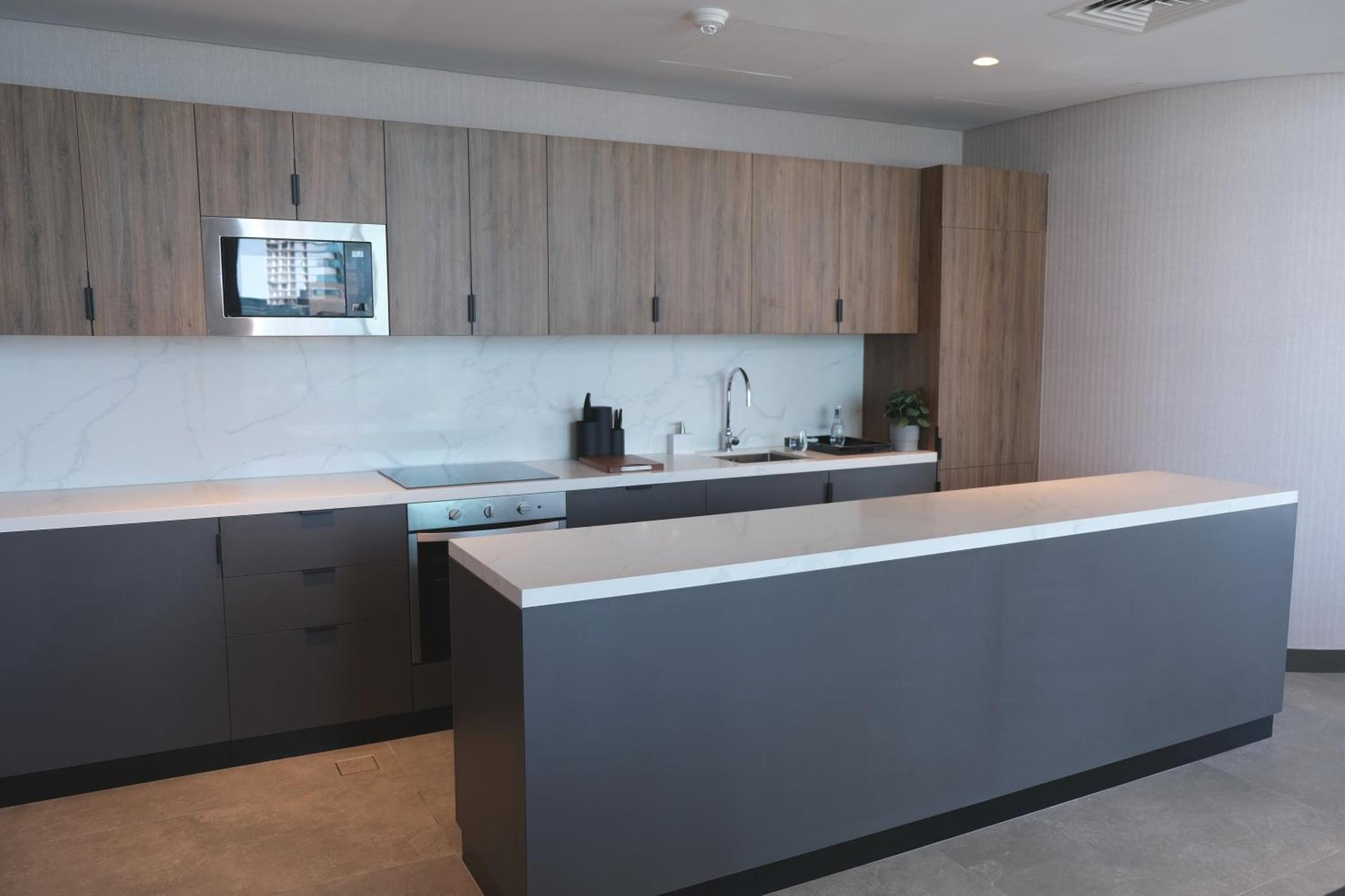 Charthouse Bahrain Hotel Manama Exterior photo A kitchen in a typical apartment